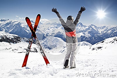 Pair of cross skis with woman skier, hands up Stock Photo