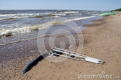 Pair crutches on beach sand near sea Stock Photo
