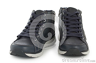 Pair of dark blue sporty sneakers, gumshoes for boy isolated on a white background, close up Stock Photo