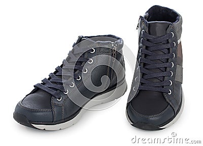 Pair of dark blue sporty sneakers, gumshoes for boy isolated on a white background, close up Stock Photo