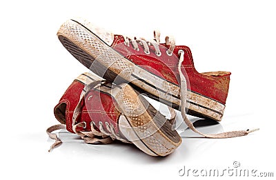 A pair of dirty sneakers isolated on white Stock Photo