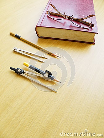 Pair of eyeglasses on book Stock Photo