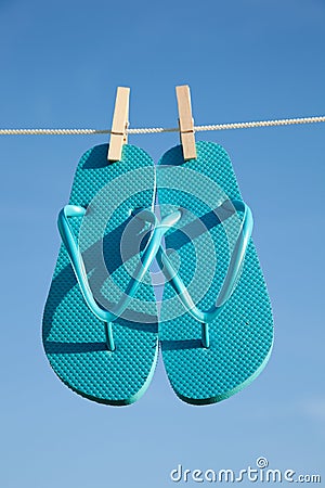 A pair of flipflops against a blue sky Stock Photo
