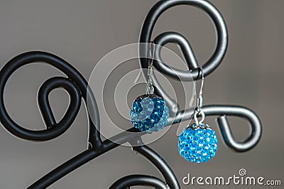 A pair of handmade earrings from beads of turquoise color Stock Photo
