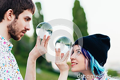 Pair juggles with large transparent balls Stock Photo