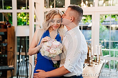 Pair of lovers. girl with bouquet of flowers donated in honor of engagement Stock Photo