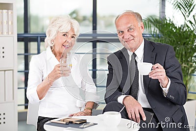 Pair of mature business workers Stock Photo