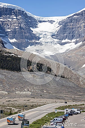 Pair of Motor Homes travelling on the Icefield Parkway in front of large glacier in Jasper National Park, Alberta, Canada Editorial Stock Photo