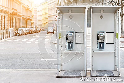 Pair of payphone booth in Vienna center street. Two modern public phones on european city street. copyspace Stock Photo