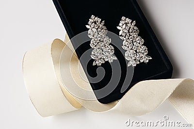 Pair of platinum earrings with diamond earrings Stock Photo