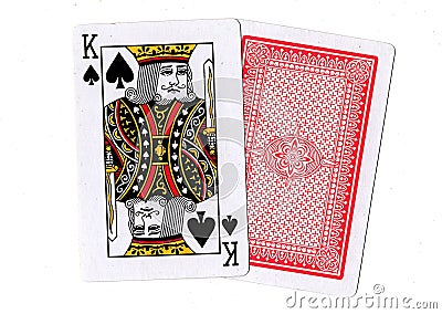 A pair of playing cards with the king of spades revealed. Stock Photo