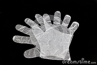 Pair of PVC disposable gloves on dark background Stock Photo