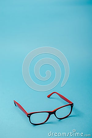 pair of red plastic-rimmed eyeglasses Stock Photo