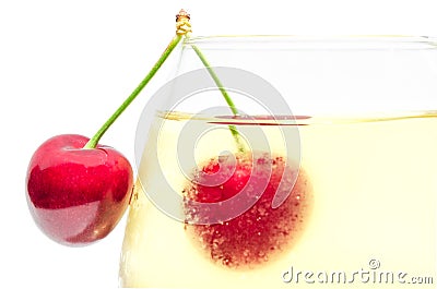 Pair of ripe cherry berries on wineglass Stock Photo