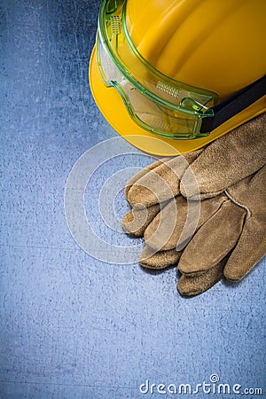 Pair of safety working gloves building helmet and transparent pr Stock Photo