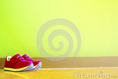 a pair of shoes leaning against the wall Stock Photo