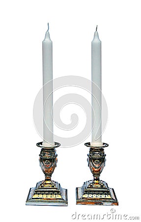 Pair of silver candlesticks isolated on white Stock Photo