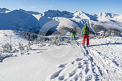 Pair of skiers in the winter in the mountains. Editorial Stock Photo