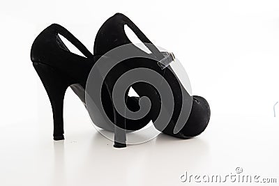 Pair of slightly used high heel stiletto woman`s shoes close up studio shot isolated on white Stock Photo