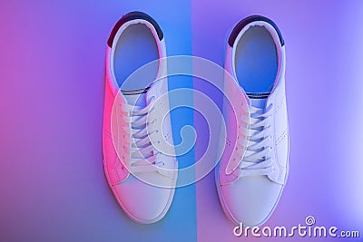 Pair of sneakers on color background, top view Stock Photo