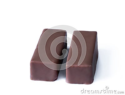 A pair of souffle candy in chocolate with vanilla and fillings isolated on white background Stock Photo