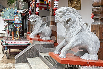 A pair of stone carved dragon statues within the Kataragama Temple in Kandy in Sri Lanka. Editorial Stock Photo