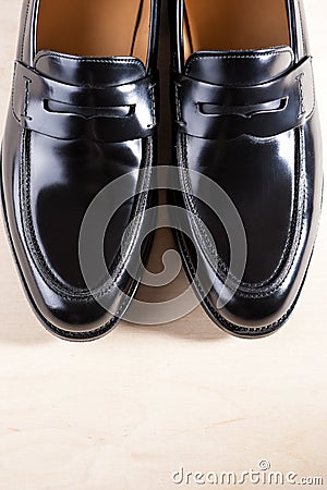 Pair of Stylish Expensive Modern Leather Black Penny Loafers Shoes.Closeup Shot Stock Photo