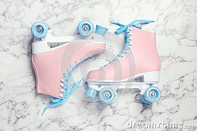 Pair of stylish quad roller skates on marble background Stock Photo