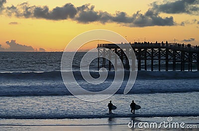 A Pair of Sunset Surfers at Crystal Pier, San Diego, CA Stock Photo