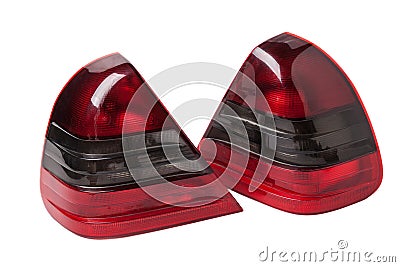 A pair of taillights of a stop signal for a German auto - optical equipment of white and red color on a white isolated background Stock Photo