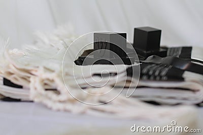 Pair of tefillin , A symbol of the Jewish people, a pair of tefillin with black straps, on a white background Stock Photo