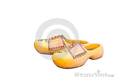 Pair of traditional Dutch yellow concrete shoes isolated on white background. Holland clog shoes Stock Photo