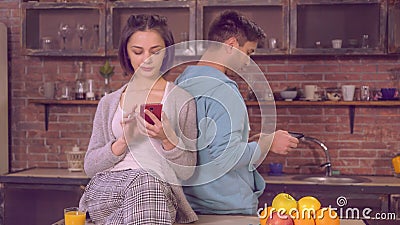 Pair use gadgets in modern apartment Stock Photo