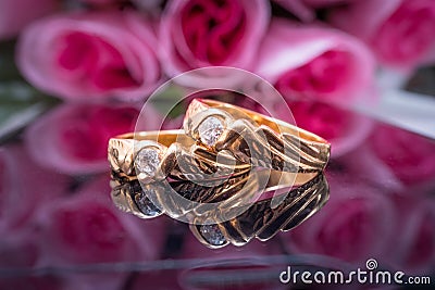 A pair of wedding rings on the glass Stock Photo