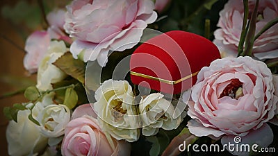 Pair of wedding rings with pastel rose for background image Stock Photo