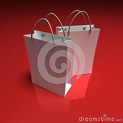 Pair of white shopping bags on a red background Stock Photo