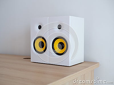 A pair of white wireless speakers on the desktop Stock Photo