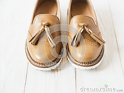 Pair of women beige leather shoes.white background Stock Photo