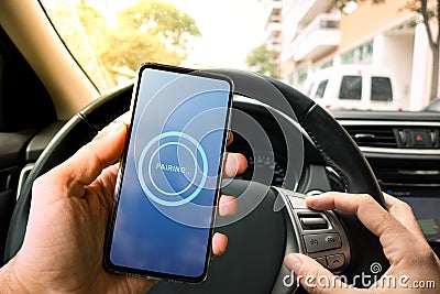 Pairing Smartphone with Car Multimedia System. Using Mobile Phone Device While Driving. Stock Photo