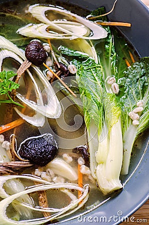 Pak choy and tea tree mushrooms soup Stock Photo