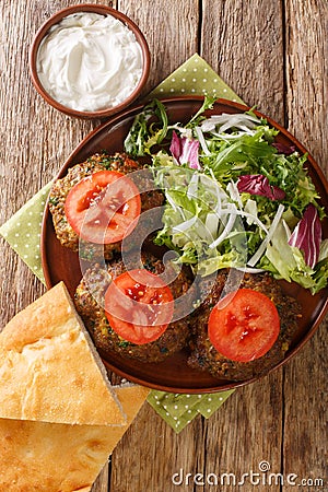 Pakistani Chapli Kebab closeup in the pan. Vertical top view Stock Photo