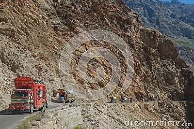 Pakistani decorated trucks travelling along the Karakoram highway. Pakistan. Stock Photo