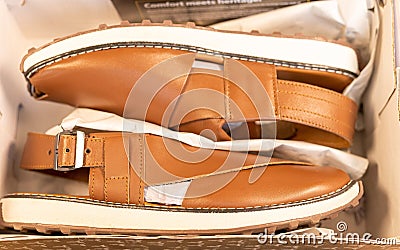 Pakistani traditional leather footwear in a box. Peshawar souvenir or gift concept Stock Photo