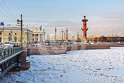 Palace Bridge and Vasilyevsky island Spit Strelka with Rostral columns in winter. Saint Petersburg, Russia Editorial Stock Photo