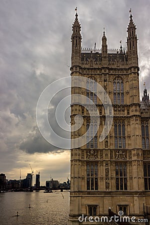 The Palace of Westminster rises up out of the west bank of the River Thames. Editorial Stock Photo