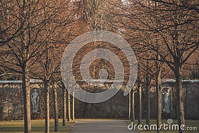 Palace yard autumn garden scenic view with bare branches trees alley way symmetry nature Stock Photo