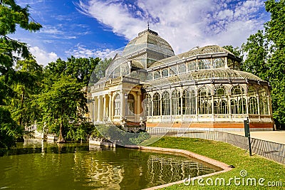 Palacio de Cristal in Madrid's Retiro public park with its lake on the main faÃ§ade, Stock Photo
