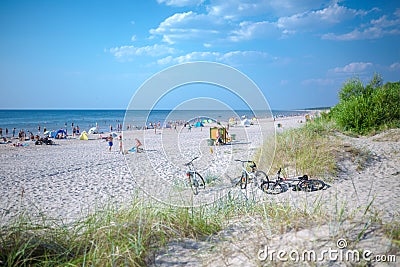 Palanga, Lithuania - Aug 03: People are relaxing on sandy beach of the Baltic sea. Seaside resort at warm summer day on Baltic sea Editorial Stock Photo