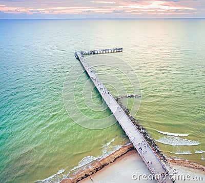 Palanga main bridge from above with tourists and baltic sea aves crashin.Holidays in baltics Stock Photo