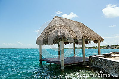 Palapa on the waterer in Lake Bacalar Mexico Stock Photo
